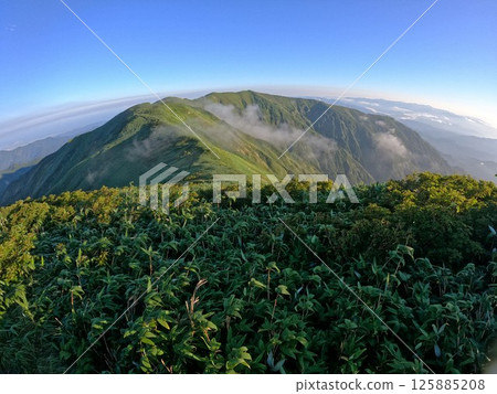 The ridgeline from the summit of Kitamata-dake to Iwasashi-dake in the Iide mountain range The ridgeline from the summit of Kitamata-dake to Iwasashi-dake in the Iide mountain range 125885208