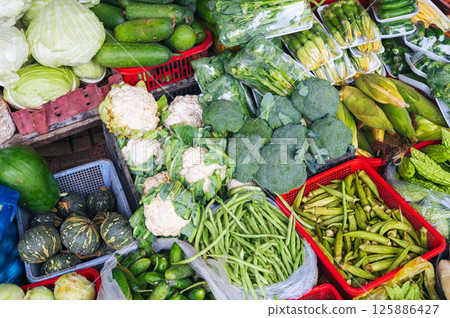 assortment of fresh vegetables on counter at the street grocery farmers market 125886427