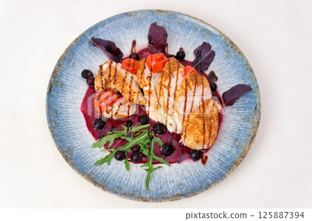 Berry sauce Delicious summer salad, chicken meat, fresh pears, ricotta cheese, red onion, nuts, spinach and arugula, white background, top view 125887394