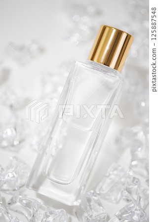 Glass cosmetic bottles and crystals Glass cosmetic bottles and crystals 125887548