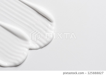 A sample of white cosmetic body moisturizer 125888827
