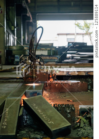 Machine for gas cutting of extra-thick steel plates at a steelworks. Cutting Machine for gas cutting of extra-thick steel plates at a steelworks. Cutting 125889114