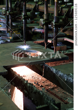 Machine for gas cutting of extra-thick steel plates at a steelworks. Cutting Machine for gas cutting of extra-thick steel plates at a steelworks. Cutting 125889116