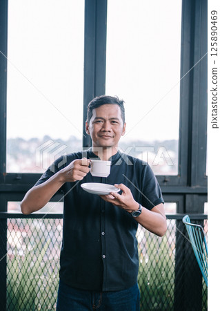 african american man using smartphone while standing outdoors african american man using smartphone while standing outdoors 125890469