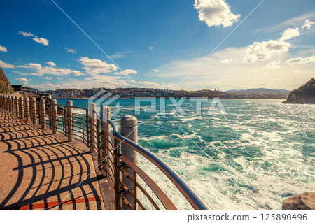 The embankment on a sunny day. Donostia San Sebastian, Basque Country, Gipuzkoa, Spain, Europe The embankment on a sunny day. Donostia San Sebastian, Basque Country, Gipuzkoa, Spain, Europe 125890496