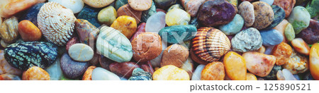 Abstract nature pebbles background. Colorful pebbles texture. Stone background. Sea pebble beach. Beautiful nature. Horizontal banner 125890521