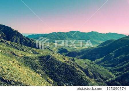 Mountain landscape in the evening. View of the mountain slopes near Barranco Bridge. Cartagena, Murcia, Spain. Aerial view 125890574