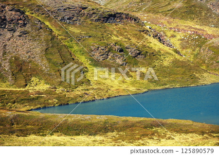 View of a mountain lake. Wilderness, beautiful harsh nature of Northern Norway, Europe 125890579