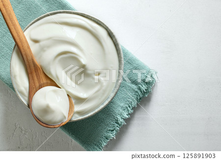 bowl of sour cream yogurt 125891903