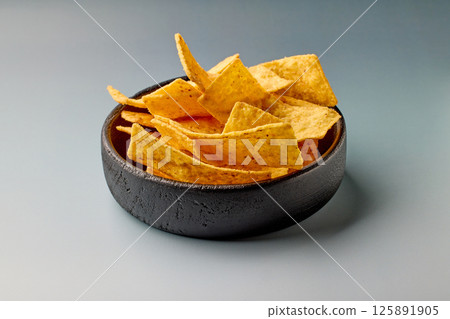 bowl of tortilla strip nachos chips bowl of tortilla strip nachos chips 125891905