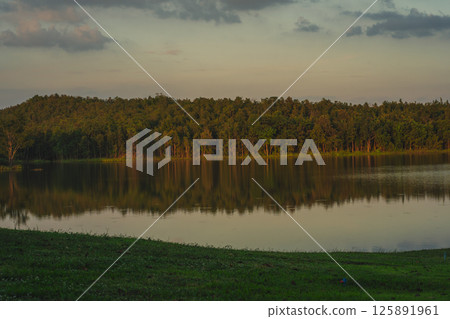 travel and people activity concept with twilight sky with reflection of mountain on lake before sunset 125891961