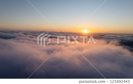Epic Sunset View in High Mountain Landscape in Madeira Island . Clouds in the Valley . Epic Sunset View in High Mountain Landscape in Madeira Island . Clouds in the Valley . 125892443