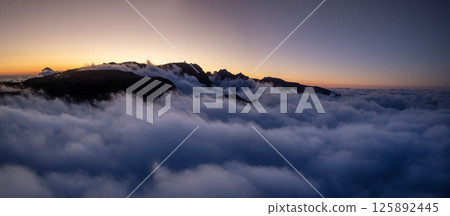 Epic Sunset View in High Mountain Landscape in Madeira Island . Clouds in the Valley . Epic Sunset View in High Mountain Landscape in Madeira Island . Clouds in the Valley . 125892445