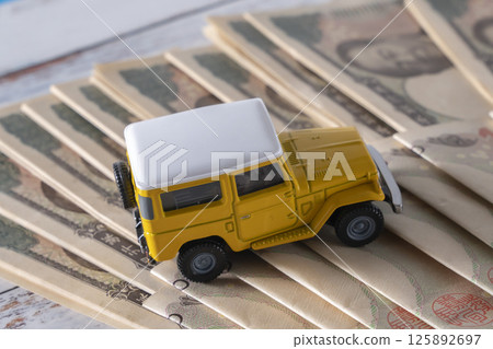 Money and SUVs Money and SUVs 125892697