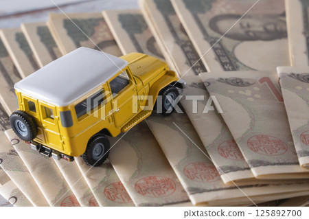 Money and SUVs 125892700