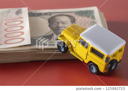 Money and SUVs 125892723