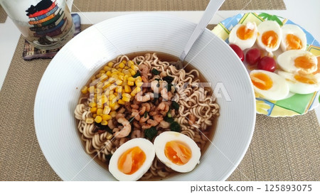 Shrimp ramen noodles soup with egg and corn kernels is ready to be eaten Shrimp ramen noodles soup with egg and corn kernels is ready to be eaten 125893075
