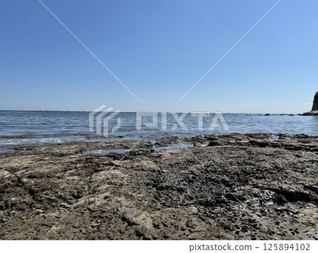 View of the rocky coast in May View of the rocky coast in May 125894102