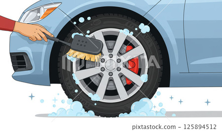 A scene from a car wash: making car tires shine with a brush! 125894512