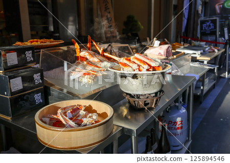 Gourmet Display of Fresh Crab Legs on Stainless Steel Dec 7 2024 Gourmet Display of Fresh Crab Legs on Stainless Steel Dec 7 2024 125894546
