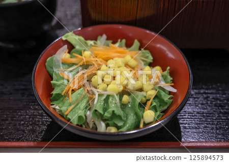 Traditional Japanese Meal with Grilled Eel and Fresh 125894573