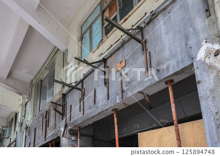 May 5 2025 Exterior View of a Dilapidated Industrial Building Under Renovation 125894748