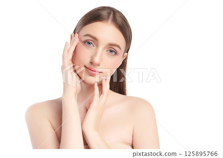 A beautiful young woman with clean, fresh skin against a white background. Skincare, facial treatment, cosmetology, beauty, and spa. An elegant portrait of an woman. A beautiful young woman with clean, fresh skin against a white background. Skincare, facial treatment, cosmetology, beauty, and spa. An elegant portrait of an woman. 125895766