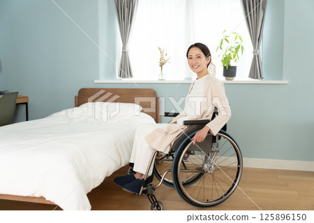 Wheelchair woman 125896150