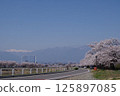 Shinshu, Matsumoto, famous cherry blossom spot, cherry blossom trees along the banks of the Usui River, snowy mountains of the Alps, Usui River (a first-class river) Shinshu, Matsumoto, famous cherry blossom spot, cherry blossom trees along the banks of the Usui River, snowy mountains of the Alps, Usui River (a first-class river) 125897085