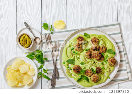 chicken broccoli meatballs with green pea hummus chicken broccoli meatballs with green pea hummus 125897820