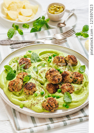chicken broccoli meatballs with green pea hummus chicken broccoli meatballs with green pea hummus 125897823