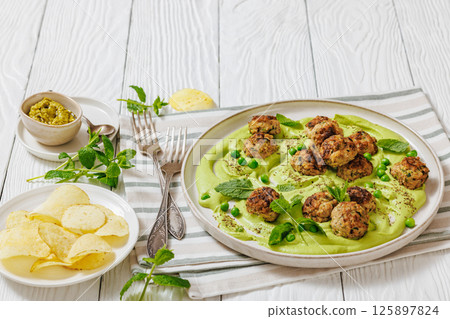 chicken broccoli meatballs with green pea hummus chicken broccoli meatballs with green pea hummus 125897824