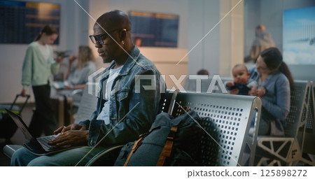 Diverse Travelers, Passengers Waiting for Airplane Flight in Departure Lounge of Airline Hub 125898272