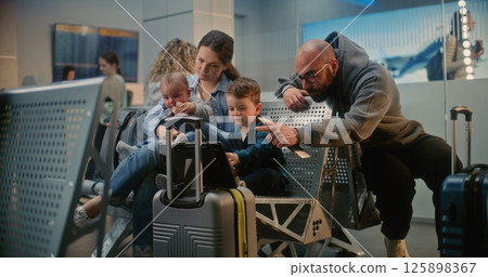 Crowded Airport Terminal: Diverse Passengers Waiting for Flight in Boarding Lounge of Airline Hub Crowded Airport Terminal: Diverse Passengers Waiting for Flight in Boarding Lounge of Airline Hub 125898367