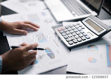 Finance bank tax expense accounting budget money businessman hand use calculator Financial calculate accountant close up calculator with graph chart write office desk Business expense analysis saving Finance bank tax expense accounting budget money businessman hand use calculator Financial calculate accountant close up calculator with graph chart write office desk Business expense analysis saving 125898657