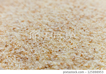 Close-up of raw semolina background in macro mode and soft focus Close-up of raw semolina background in macro mode and soft focus 125898953