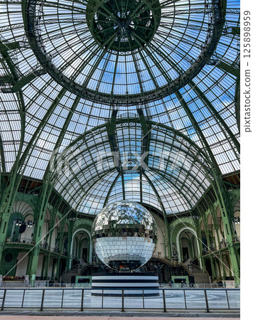 A giant disco ball on an empty Grand Palais skating rink. High quality photo A giant disco ball on an empty Grand Palais skating rink. High quality photo 125898959
