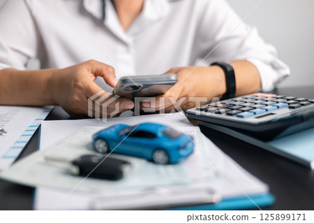 Finance bank tax expense accounting budget money businessman hand for Business expense analysis saving use car Financial calculate accountant close up calculator with graph chart write office desk 125899171