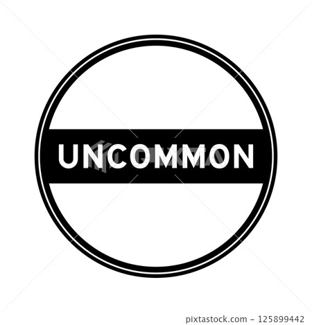 Black color round seal sticker in word uncommon on white background Black color round seal sticker in word uncommon on white background 125899442