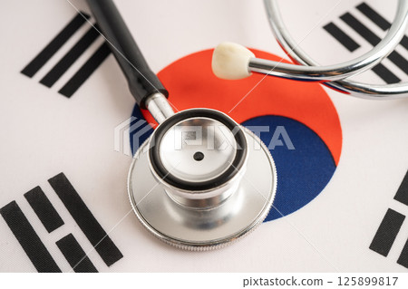 Stethoscope on South Korea flag, Business and finance. Stethoscope on South Korea flag, Business and finance. 125899817