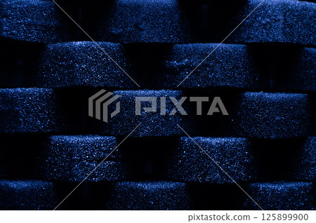 Blue Cubes of flexible foam sponges laid out in a pattern. Macro close-up in soft focus. Abstract cubic background Blue Cubes of flexible foam sponges laid out in a pattern. Macro close-up in soft focus. Abstract cubic background 125899900