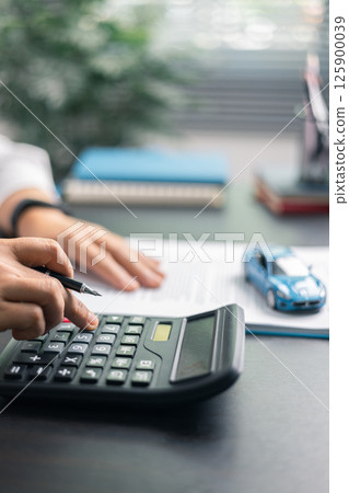 Finance bank tax expense accounting budget money businessman hand for Business expense analysis saving use car Financial calculate accountant close up calculator with graph chart write office desk Finance bank tax expense accounting budget money businessman hand for Business expense analysis saving use car Financial calculate accountant close up calculator with graph chart write office desk 125900039
