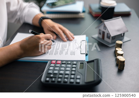 Finance bank tax expense accounting budget money businessman home for Business expense analysis saving use Financial calculate accountant close up calculator with graph chart hand write office desk Finance bank tax expense accounting budget money businessman home for Business expense analysis saving use Financial calculate accountant close up calculator with graph chart hand write office desk 125900540