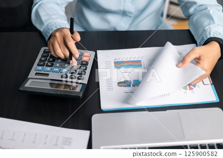 Finance bank tax expense accounting budget money businessman hand use calculator Financial calculate accountant close up calculator with graph chart write office desk Business expense analysis saving Finance bank tax expense accounting budget money businessman hand use calculator Financial calculate accountant close up calculator with graph chart write office desk Business expense analysis saving 125900582