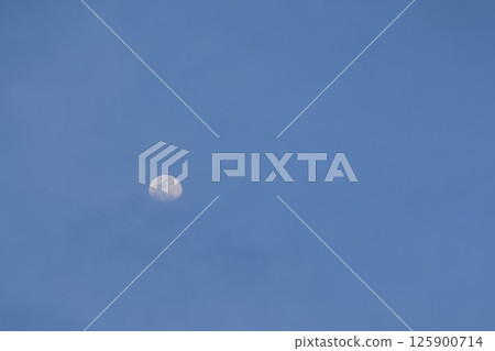 half moon floating on blue sky in twilight background  125900714