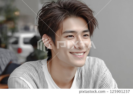 A handsome young Japanese man with a cute smile 125901237