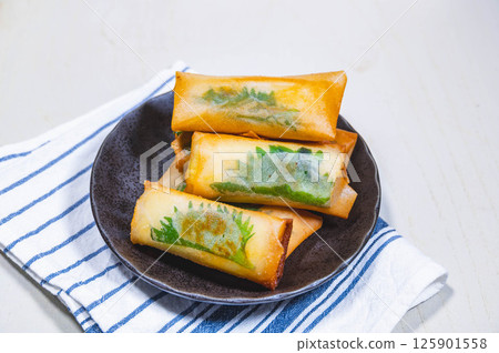 Fried tofu and cheese spring rolls 125901558