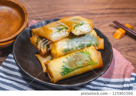 Fried tofu and cheese spring rolls 125901560