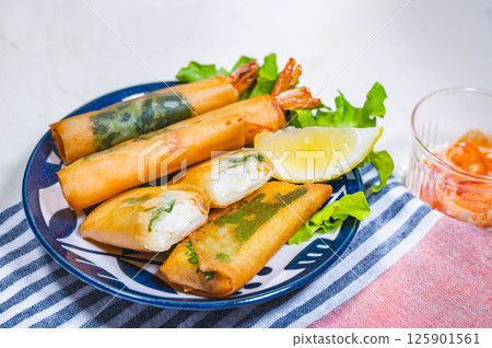 Deep-fried tofu and shrimp spring rolls 125901561
