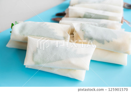 Melted cheese spring rolls 125901570